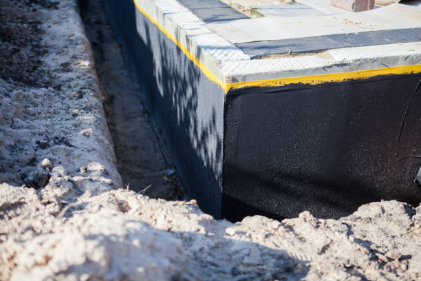 Professional Waterproofing technician working in Gibson Island, MD